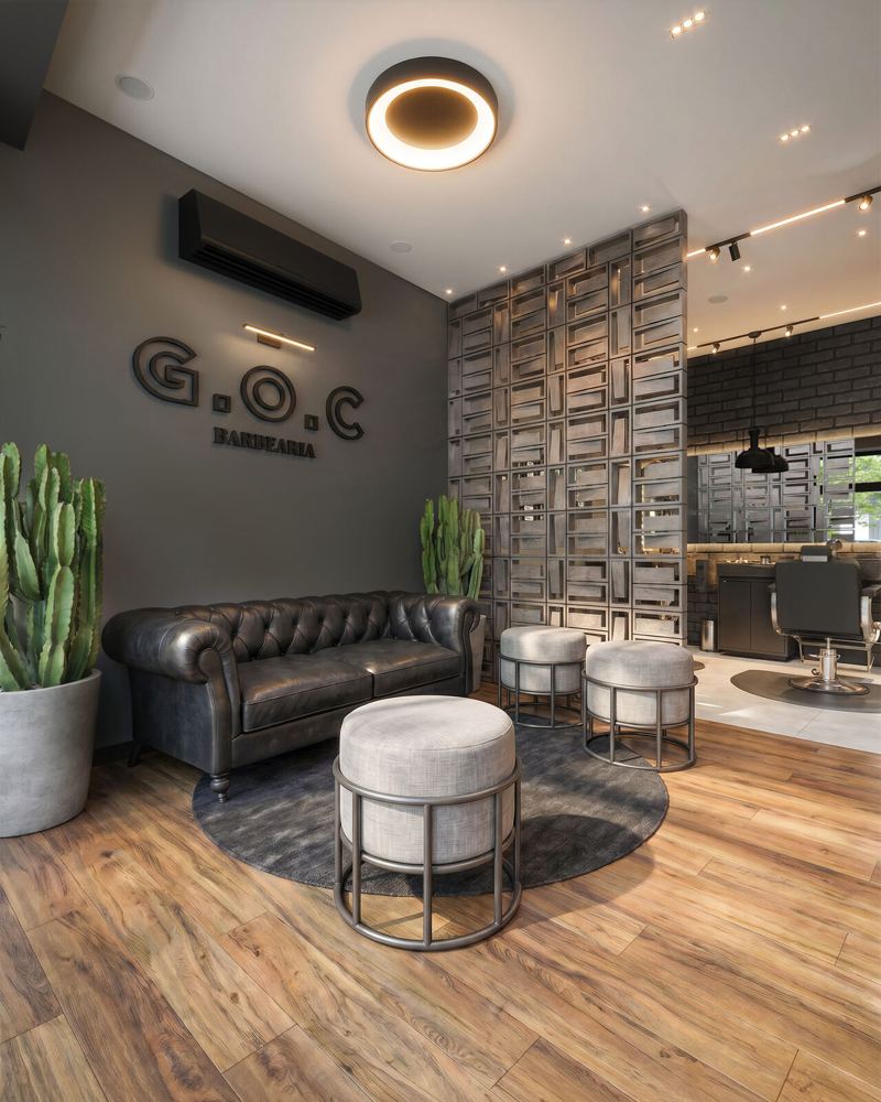 GOC Barbearia: espera com sofá chesterfield e logo da marca