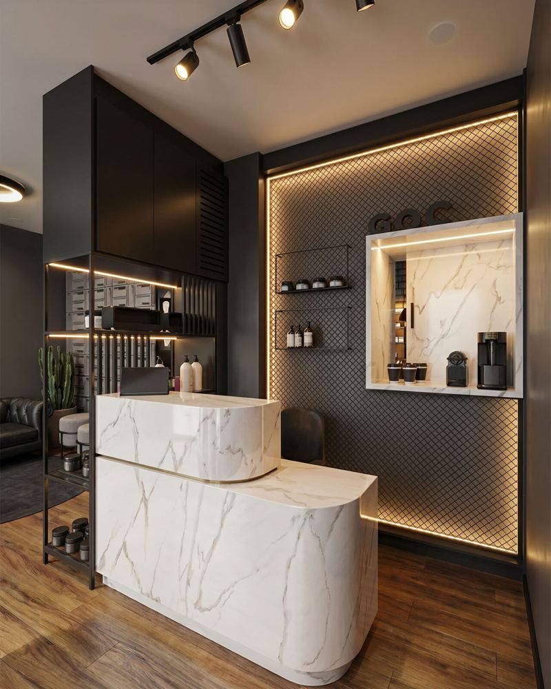 GOC Barbearia: recepção com balcão curvo em mármore